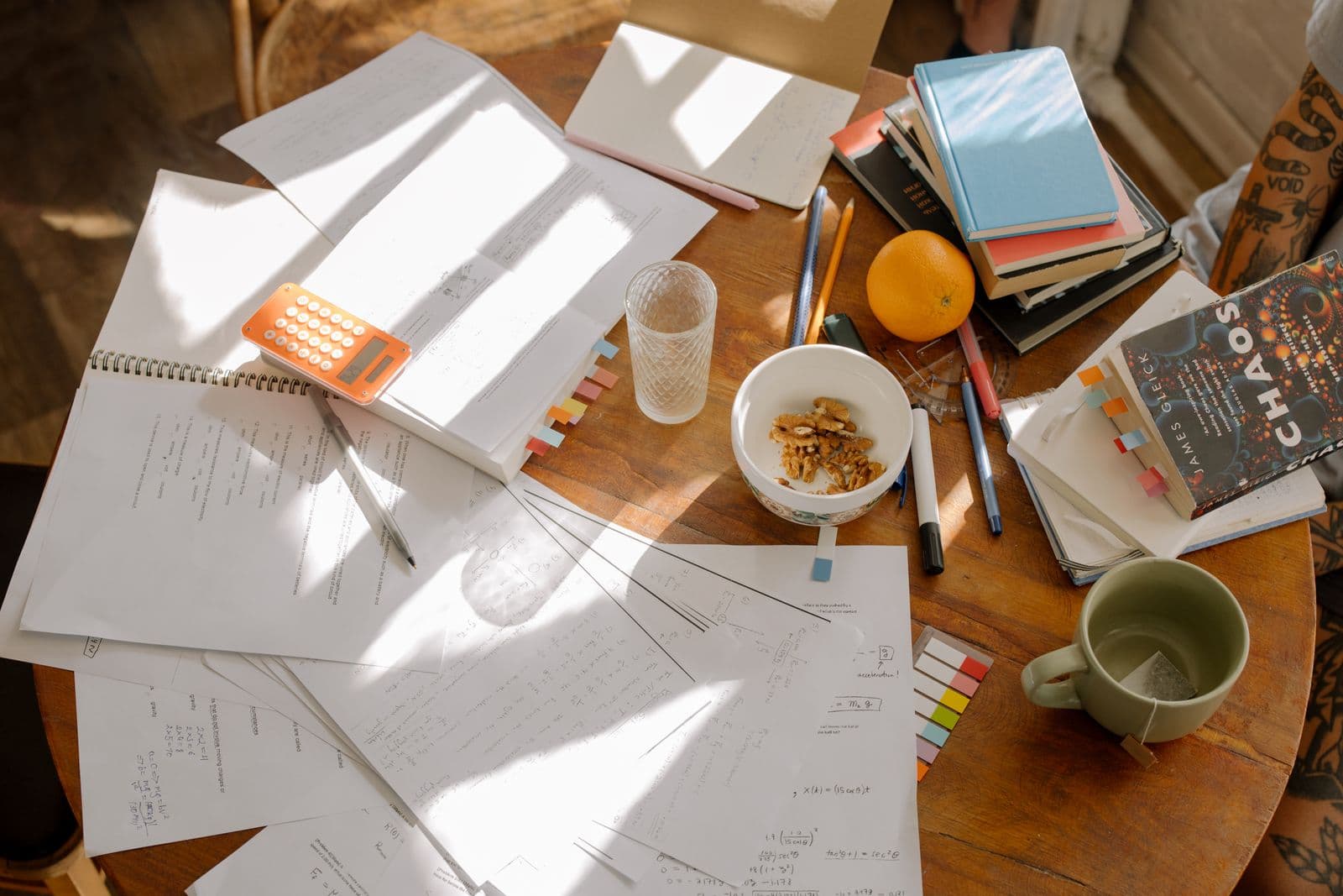 A student writing notes by hand